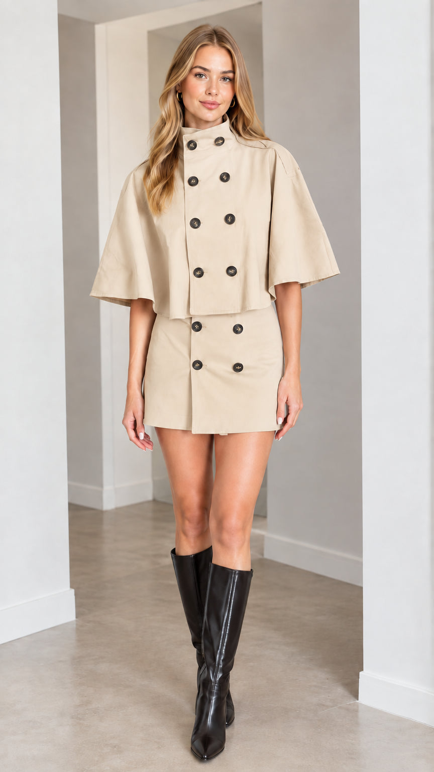 Full-length studio shot of model in beige double-breasted cape skirt set