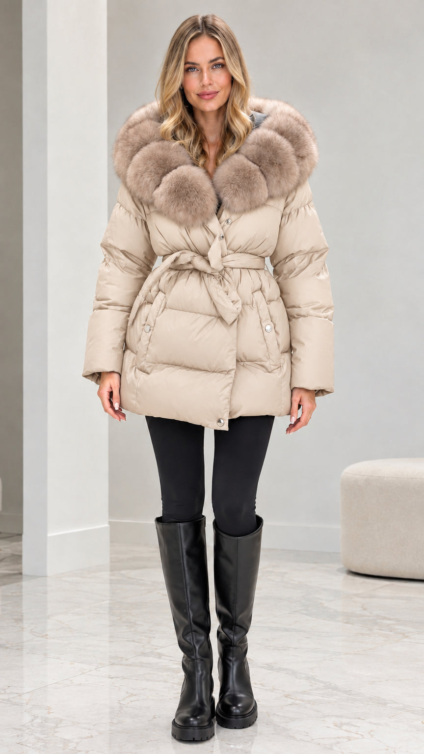 Front view of model wearing beige cream belted quilted puffer coat
