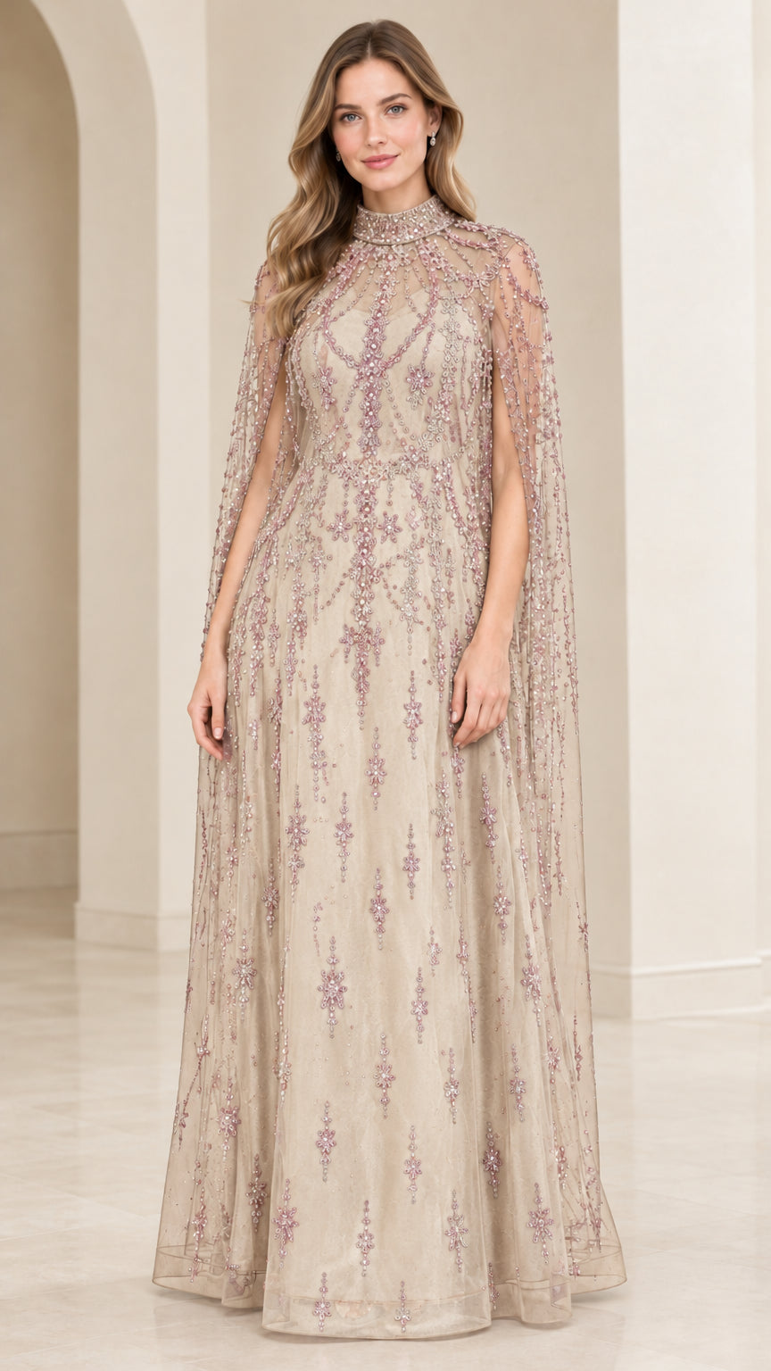 Model wearing Champagne neutral beaded evening gown with floor-length cape